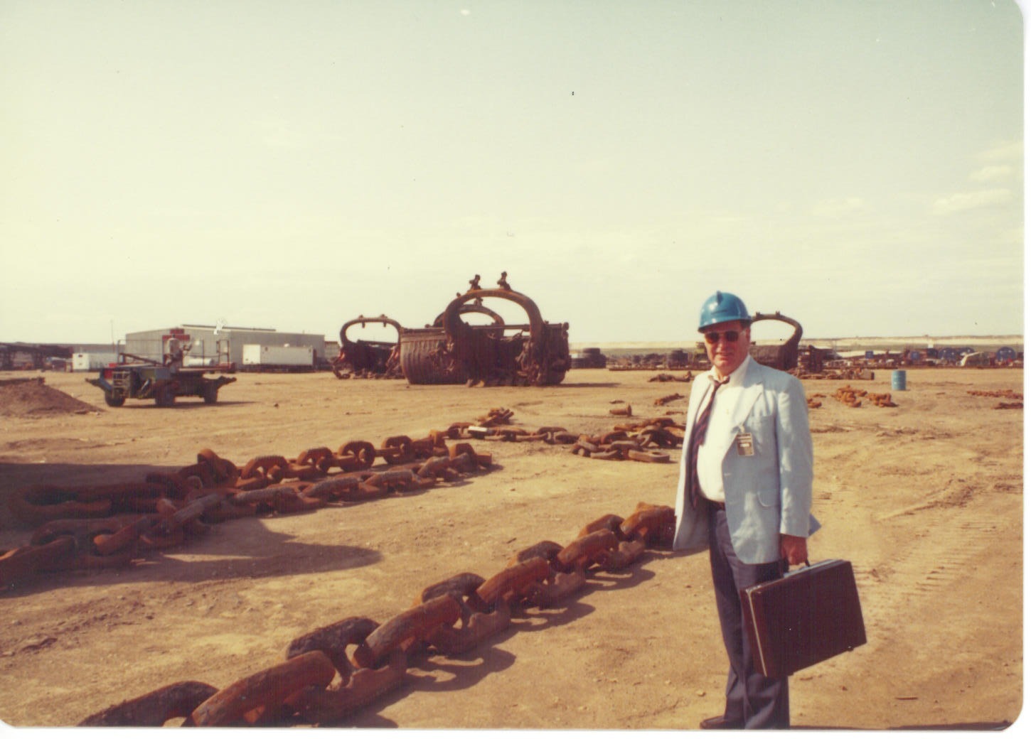 Bill Lloyd blue blazer hardhat briefcase dragline chain buckets oil sands Alberta 1980